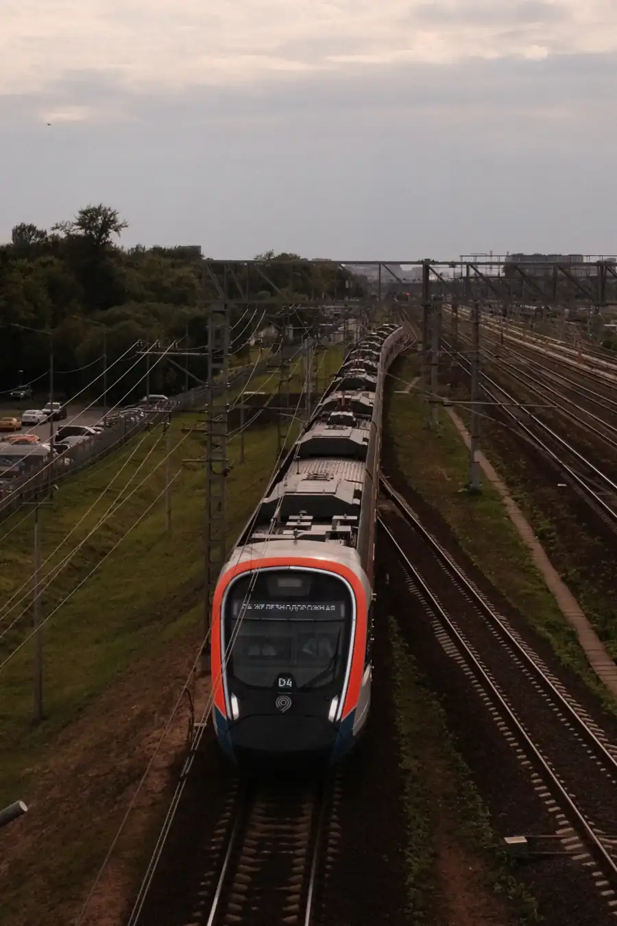 Passenger train on a railway line with overhead wires