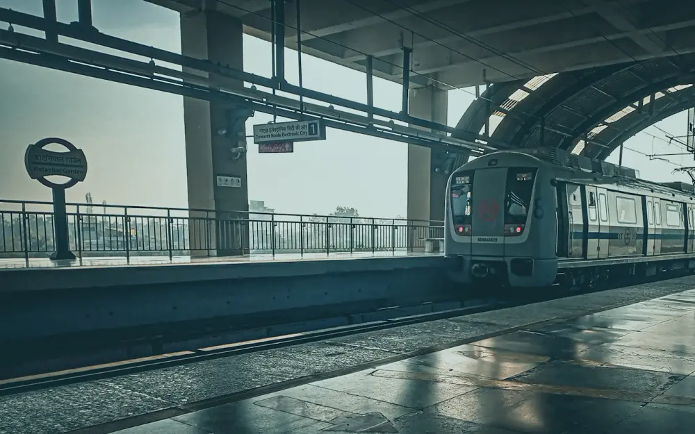 Metro train arriving at an elevated station platform